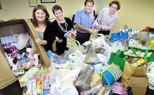 Fraser Coast Chronicle staff with some of the hundreds of goods donated earlier this year for We Care Bags. Fraser Coast Chronicle staff with some of the hundreds of goods donated earlier this year for We Care Bags.